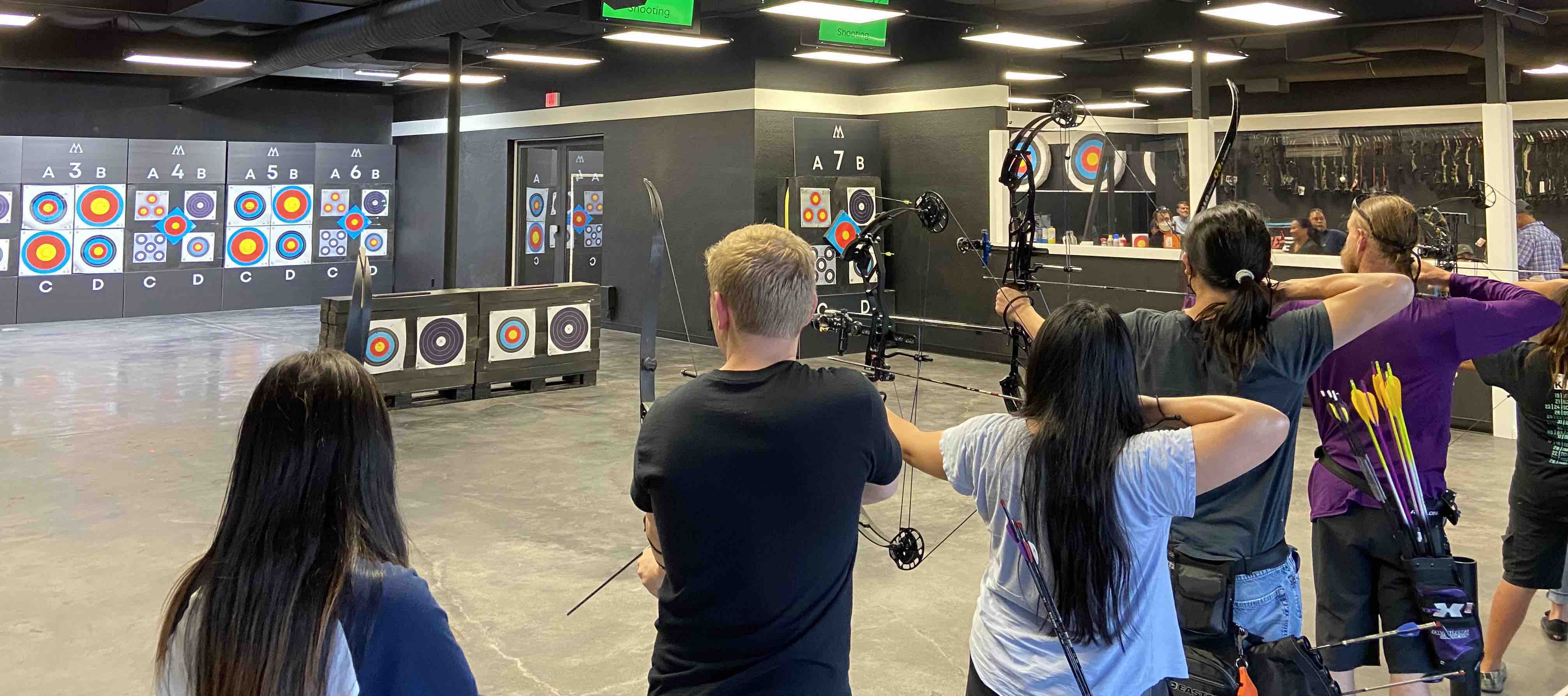 indoor range showing targets and archers